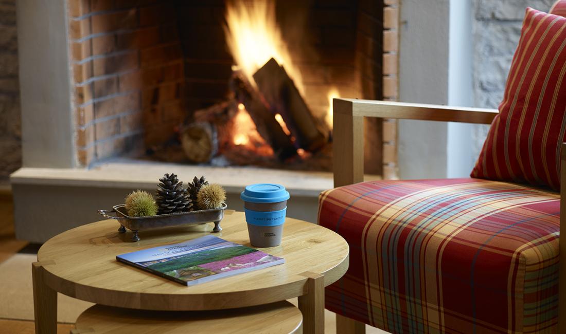 Cozy chair in front of the fireplace 